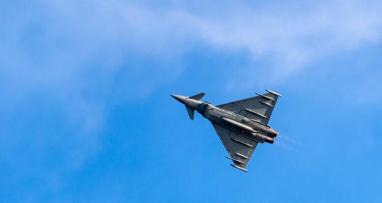 gray jet plane in mid air